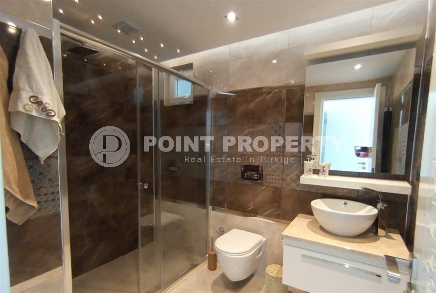 Двухуровневая квартира 2+1 с собственным садом, в 750 метрах от моря, в популярном районе Аланьи - Оба-id-5606-фото-9