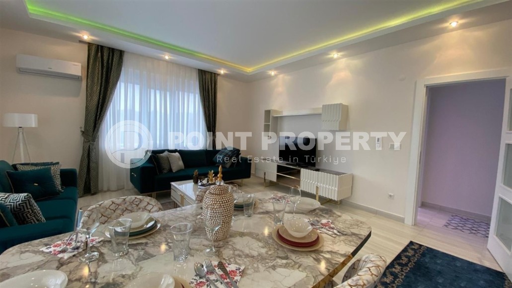 Comfortable apartment with modern design, stylish furniture and appliances, within walking distance from the center of Mahmutlar-id-5611-photo-2