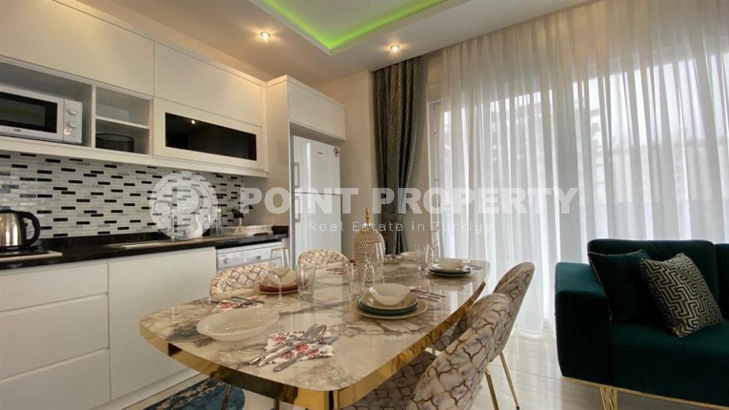 Comfortable apartment with modern design, stylish furniture and appliances, within walking distance from the center of Mahmutlar-id-5611-photo-3