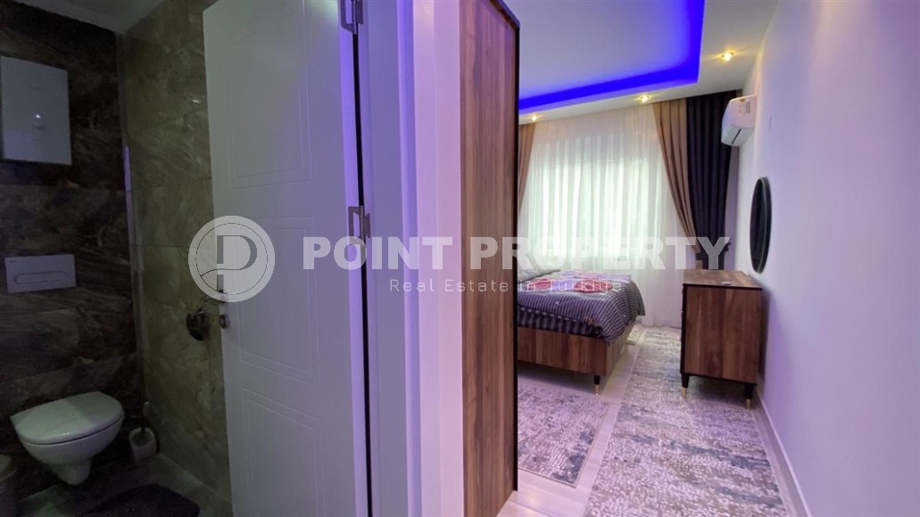 Comfortable apartment with modern design, stylish furniture and appliances, within walking distance from the center of Mahmutlar-id-5611-photo-7