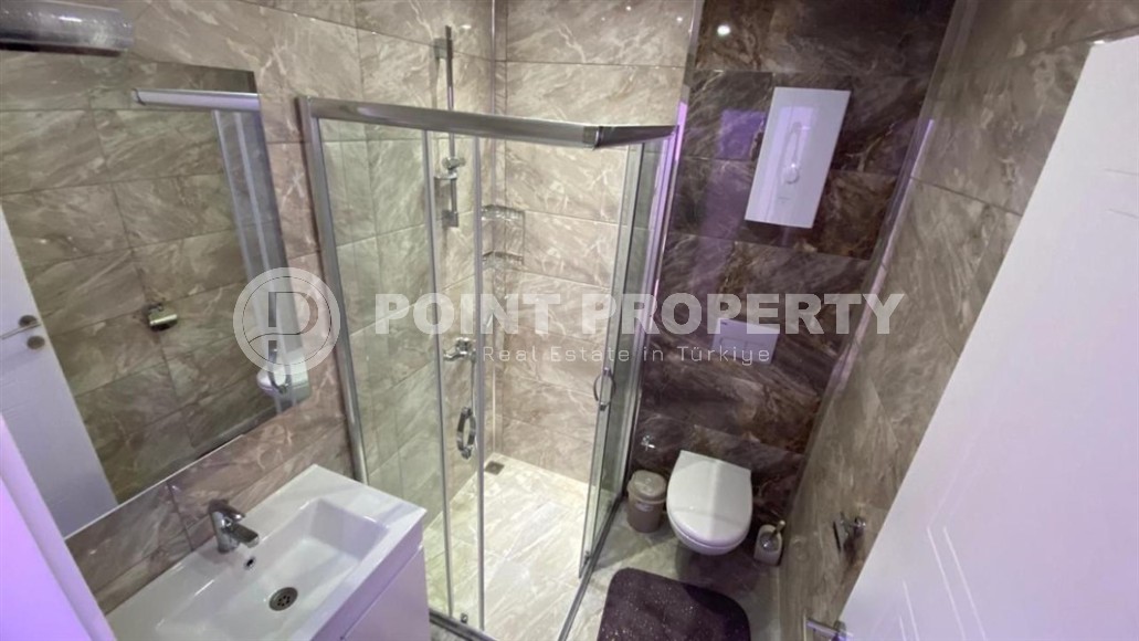 Comfortable apartment with modern design, stylish furniture and appliances, within walking distance from the center of Mahmutlar-id-5611-photo-8