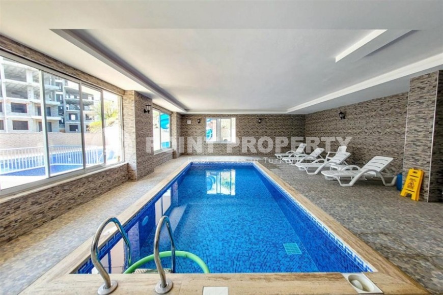 Comfortable apartment with modern design, stylish furniture and appliances, within walking distance from the center of Mahmutlar-id-5611-photo-13