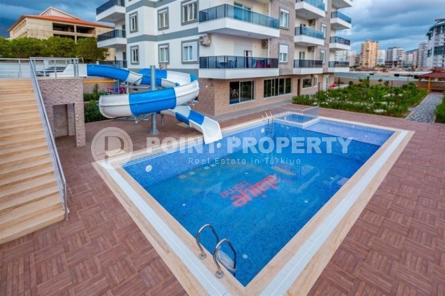 Comfortable apartment with modern design, stylish furniture and appliances, within walking distance from the center of Mahmutlar-id-5611-photo-14