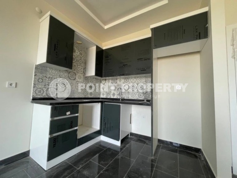 A small new apartment with a fine finish 50 meters from the sea, in the center of a picturesque, environmentally friendly area of Alanya - Demirtas-id-5637-photo-3