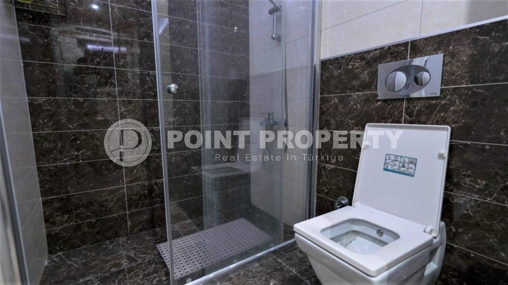 Просторная квартира с одной спальной комнатой в центре спокойного, комфортабельного района Аланьи - Тосмур-id-5647-фото-6