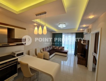 Панорамная квартира с видом на город и Торосские горы, на 9-м этаже в центре района Махмутлар-id-5653-фото-1