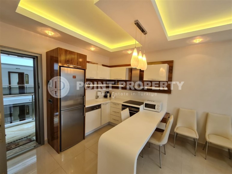 Панорамная квартира с видом на город и Торосские горы, на 9-м этаже в центре района Махмутлар-id-5653-фото-2