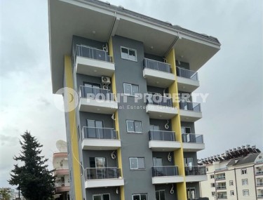 Новая квартира с чистовой отделкой в 800 метрах от моря в спокойном, благоустроенном районе Аланьи - Авсаллар-id-5666-фото-1