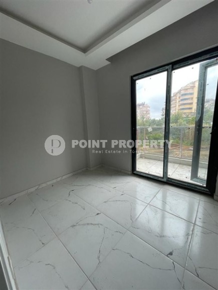 Новая квартира с чистовой отделкой в 800 метрах от моря в спокойном, благоустроенном районе Аланьи - Авсаллар-id-5666-фото-4