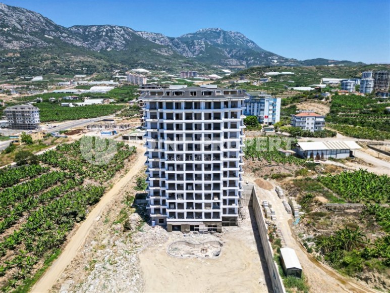 Небольшая квартира на 4-м этаже в жилом комплексе на финальном этапе строительства, в центре современного района Аланьи - Махмутлар-id-5684-фото-12