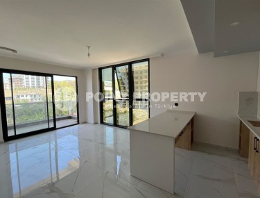 Небольшая квартира 1+1, общей площадью 50 м2, в перспективном, благоустроенном районе Аланьи - Авсаллар-id-5703-фото-2