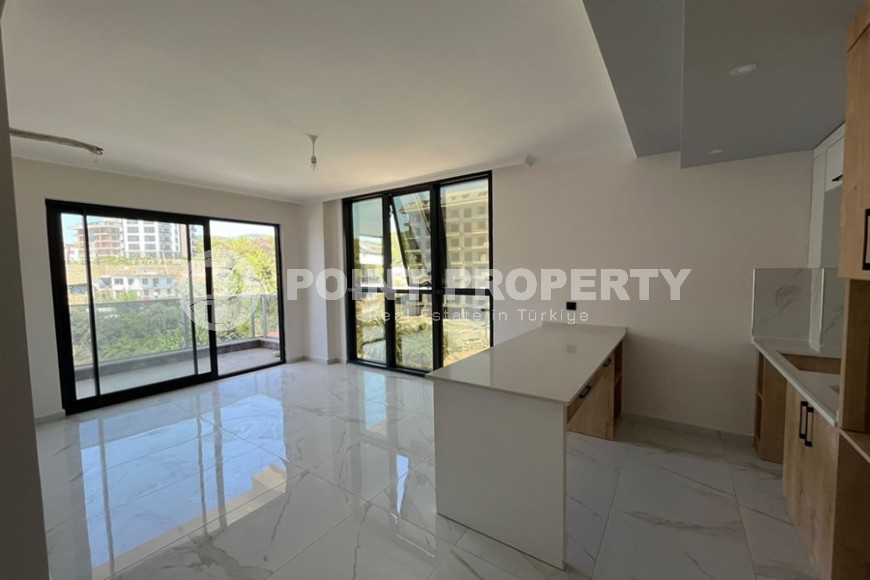 Небольшая квартира 1+1, общей площадью 50 м2, в перспективном, благоустроенном районе Аланьи - Авсаллар-id-5703-фото-2