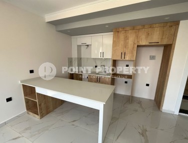 Небольшая квартира 1+1, общей площадью 50 м2, в перспективном, благоустроенном районе Аланьи - Авсаллар-id-5703-фото-3