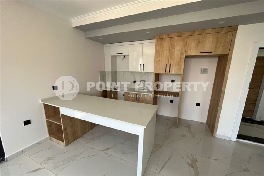 Небольшая квартира 1+1, общей площадью 50 м2, в перспективном, благоустроенном районе Аланьи - Авсаллар-id-5703-фото-3