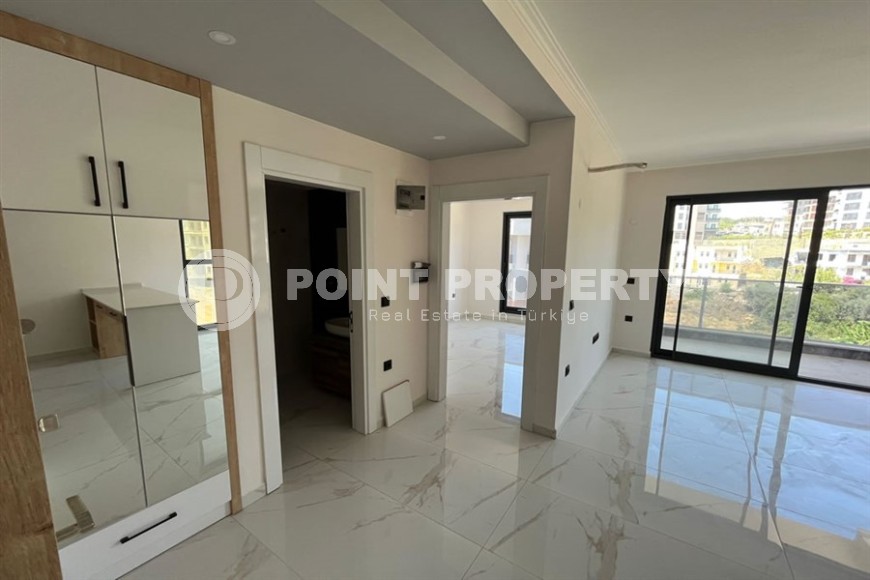 Небольшая квартира 1+1, общей площадью 50 м2, в перспективном, благоустроенном районе Аланьи - Авсаллар-id-5703-фото-4