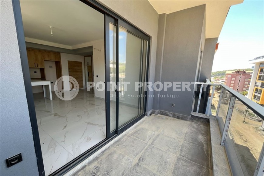 Небольшая квартира 1+1, общей площадью 50 м2, в перспективном, благоустроенном районе Аланьи - Авсаллар-id-5703-фото-7