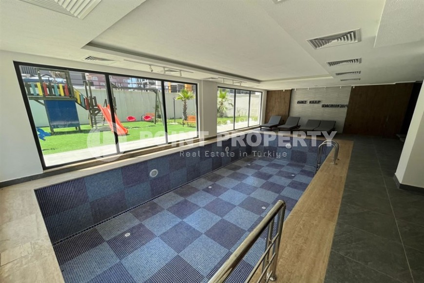 Небольшая квартира 1+1, общей площадью 50 м2, в перспективном, благоустроенном районе Аланьи - Авсаллар-id-5703-фото-12