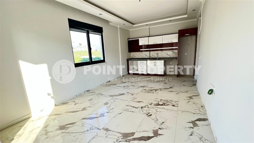 Небольшие апартаменты 1+1, общей площадью 55 м2, в 750 метрах от моря, в центре района Махмутлар-id-5707-фото-2