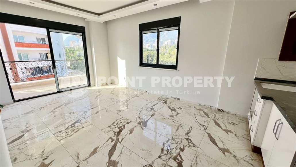 Небольшие апартаменты 1+1, общей площадью 55 м2, в 750 метрах от моря, в центре района Махмутлар-id-5707-фото-3