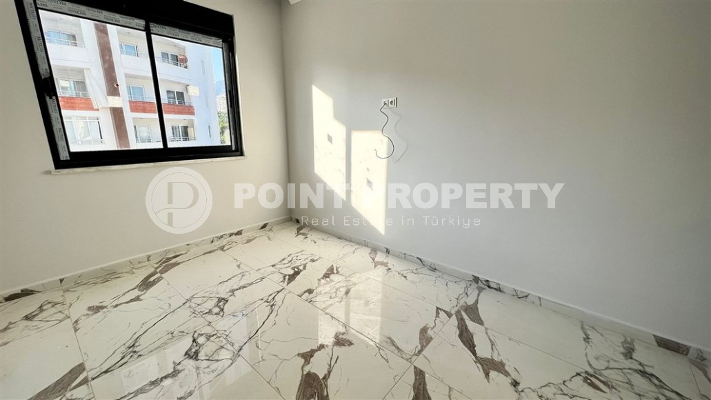 Небольшие апартаменты 1+1, общей площадью 55 м2, в 750 метрах от моря, в центре района Махмутлар-id-5707-фото-4