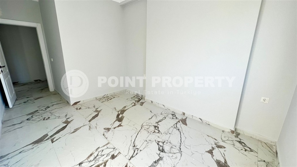 Небольшие апартаменты 1+1, общей площадью 55 м2, в 750 метрах от моря, в центре района Махмутлар-id-5707-фото-6