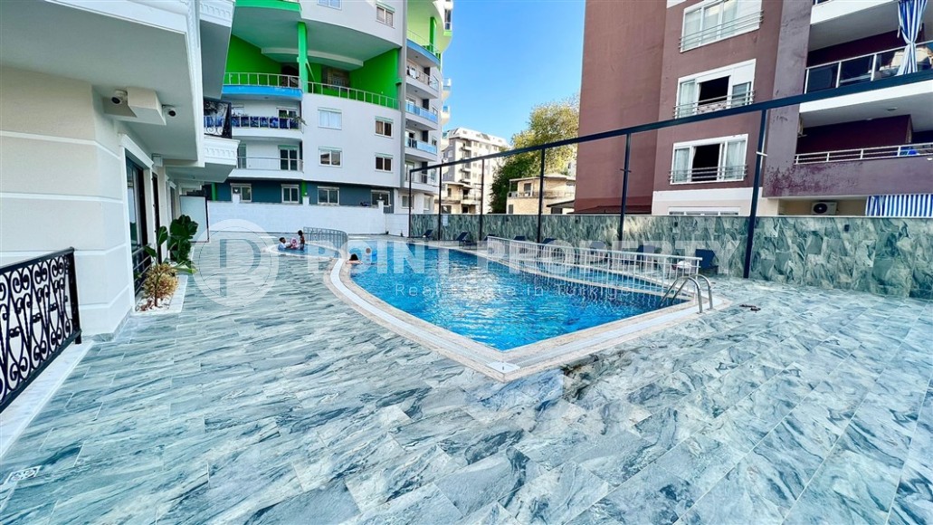 Небольшие апартаменты 1+1, общей площадью 55 м2, в 750 метрах от моря, в центре района Махмутлар-id-5707-фото-16