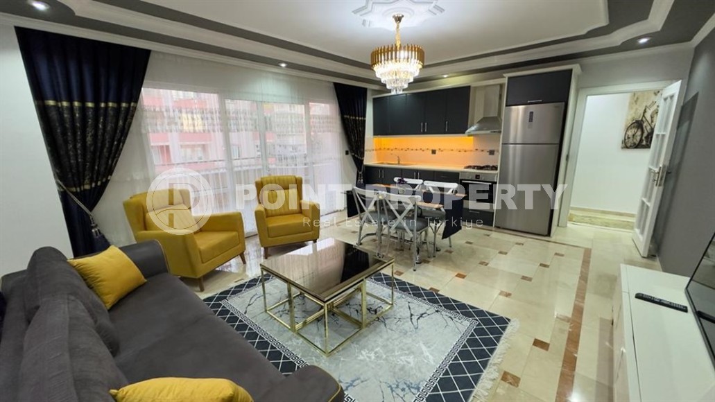 Stylish modern apartment 1+1, with a total area of 70 m2, on the first line from the sea, in the Mahmutlar area-id-5802-photo-2