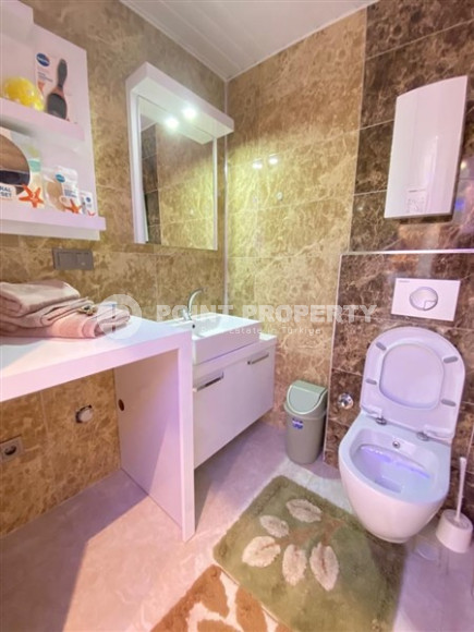 Large one bedroom apartment, 70m², with sea and mountain views in Mahmutlar, Alanya-id-1454-photo-21