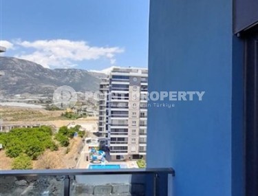 Small apartment 1+1, with a total area of 54 m2, 700 meters from the sea, in the center of Mahmutlar-id-5816-photo-4