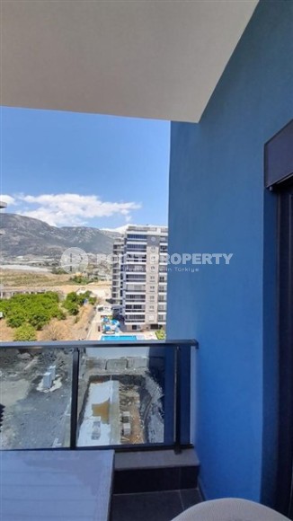 Small apartment 1+1, with a total area of 54 m2, 700 meters from the sea, in the center of Mahmutlar-id-5816-photo-4