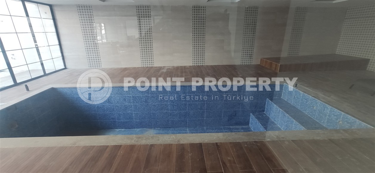 Small apartment 1+1, with a total area of 54 m2, 700 meters from the sea, in the center of Mahmutlar-id-5816-photo-7