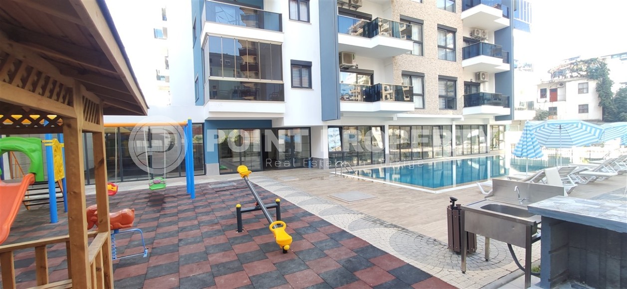 Small apartment 1+1, with a total area of 54 m2, 700 meters from the sea, in the center of Mahmutlar-id-5816-photo-10