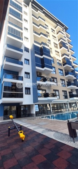 Small apartment 1+1, with a total area of 54 m2, 700 meters from the sea, in the center of Mahmutlar-id-5816-photo-12