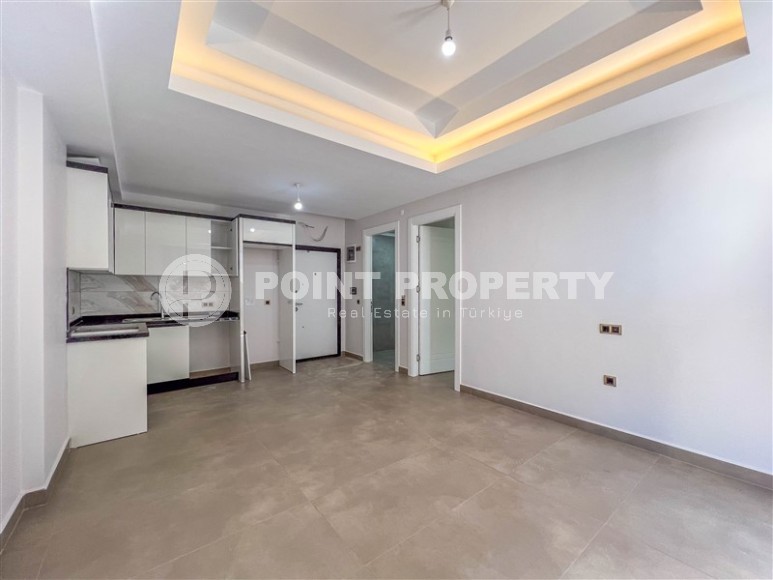 Новая квартира с чистовой отделкой, в самом центре района Махмутлар, и в 150 метрах от моря-id-5834-фото-2