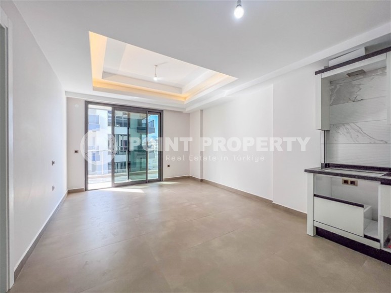 Новая квартира с чистовой отделкой, в самом центре района Махмутлар, и в 150 метрах от моря-id-5834-фото-4