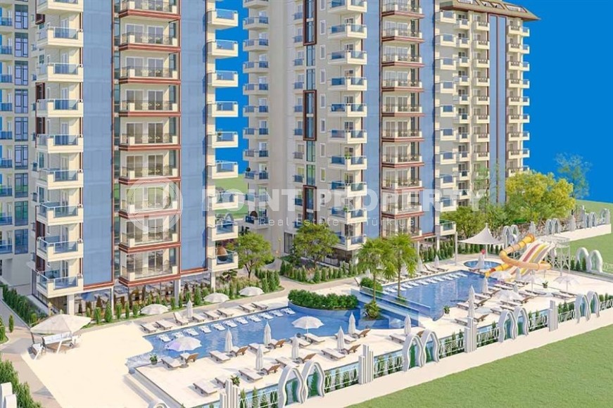 Апартаменты в жилом комплексе на этапе строительства, в 450 метрах от моря, в центре района Махмутлар-id-5840-фото-1