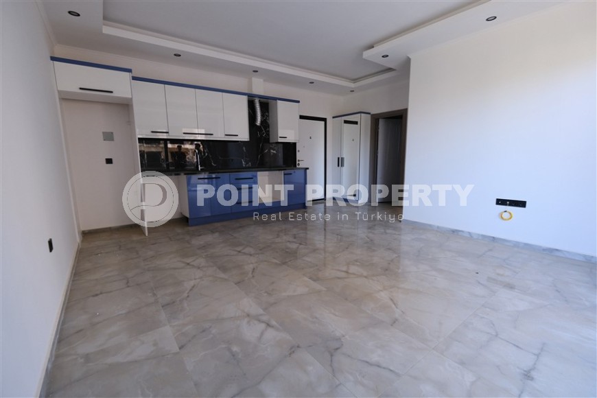Небольшая новая квартира с чистовой отделкой, в центре современного района Аланьи - Махмутлар-id-5876-фото-2