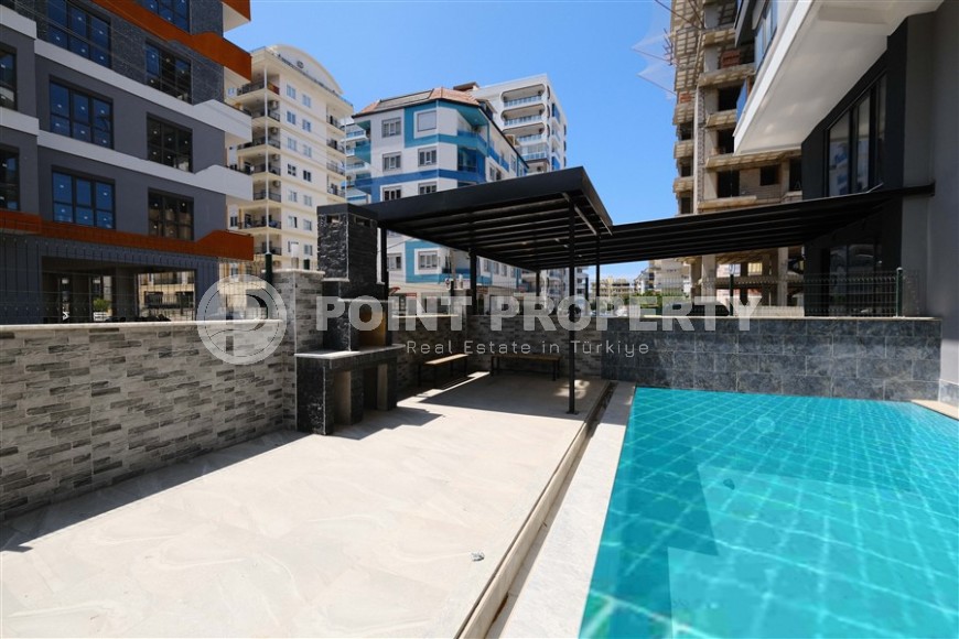 Небольшая новая квартира с чистовой отделкой, в центре современного района Аланьи - Махмутлар-id-5876-фото-12