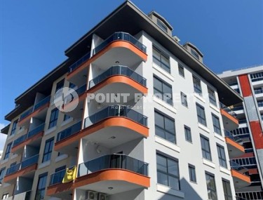 New apartment with fine finishing 650 meters from the sea, in the center of Mahmutlar-id-5929-photo-1